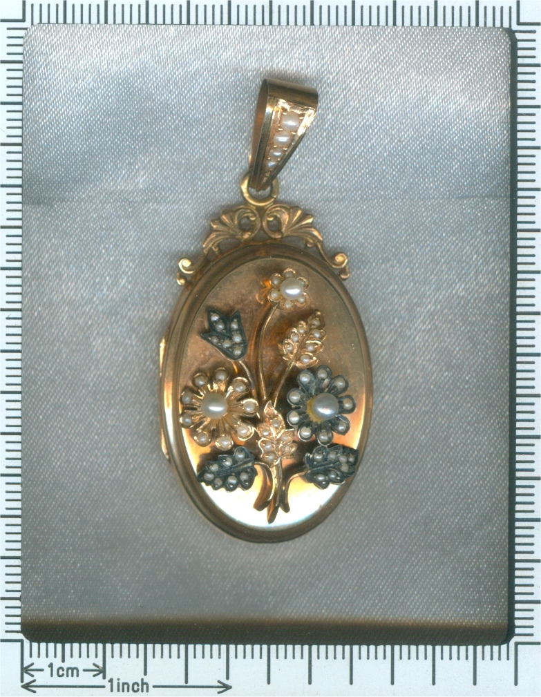Victorian rose gold locket with seed pearl set bouquet of flowers on top